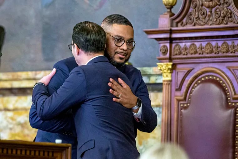 Pennsylvania Gov. Josh Shapiro and Lt. Gov. Austin Davis, right, embrace before the governor's first budget address to a joint session of the state legislature on Tuesday, March 7, 2023.