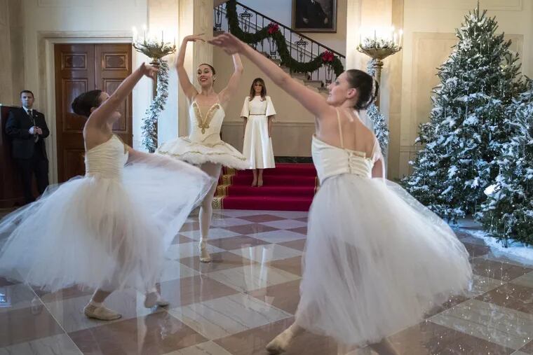 First Lady Melania Trump watches as ballerinas perform a piece from “The Nutcracker” among the 2017 holiday decorations in the Grand Foyer of the White House.