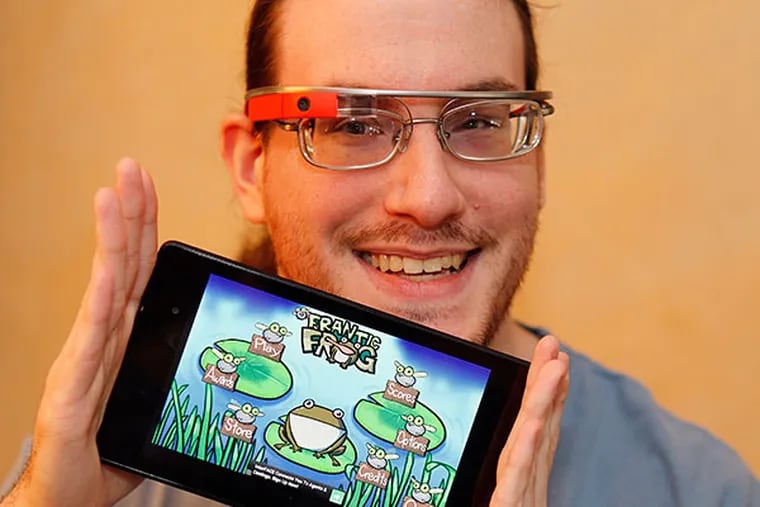 Dan Fishbach, 27 shows his creation, a game called "Frantic Frog" on his Nexus tablet on Tuesday, April 8, 2014. ( AKIRA SUWA  /  Staff Photographer )