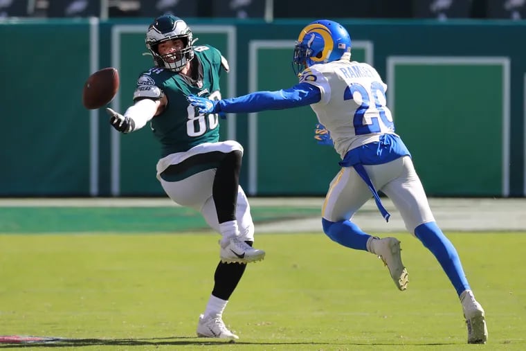 Eagles tight end Dallas Goedert could not hang on to a pass as Rams cornerback Jalen Ramsey defends.