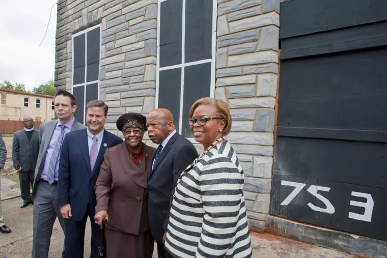 (L to R) In this file p photo, local social Activist Patrick Duff, U.S. Rep. Donald Norcross, Jeanette Lily Hunt, Civil right icon and U. S. Rep. John Lewis and former Camden Mayor Dana Redd pose in front of the Walnut Street house that Ms. Hunt owns in Camden where Rev. Dr. Martin Luther King Jr. lived while a student at Crozer Theology Seminary in the 1950s.