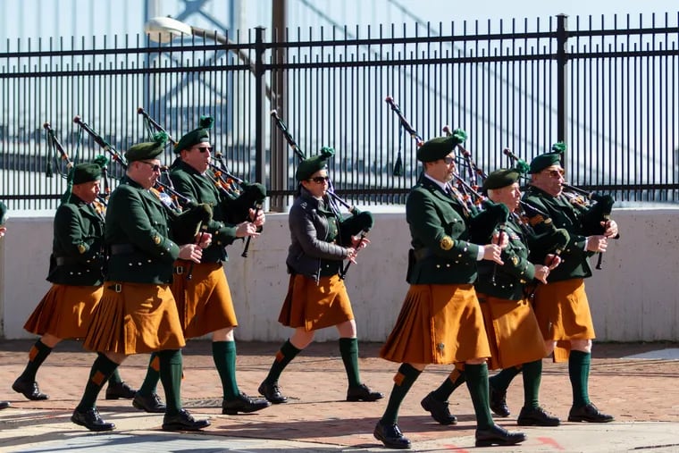 Emerald Society Pipe Band walks down Delaware Avenue near Chestnut Street toward the Irish Memorial for the St. Patrick's Day Celebration in Philadelphia, PA, Sunday, March 17, 2019. This year's St. Patrick's Day parade was canceled amid fear of the spread of the new coronavirus.