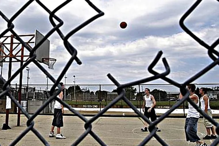 A sharp, broken fence at the American Legion Rec Center in Wissinoming was among the numerous hazards and maintenance issues found by an audit of Philadelphia's recreation centers. (Tom Gralish / Inquirer)
