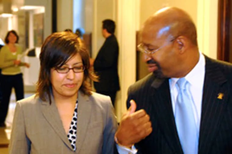 Gloria A. Casarez, with Mayor Michael Nutter, at a news conference in 2008 announcing her appointment as city liaison to the lesbian, gay, bisexual and transgender communities. (TOM GRALISH / Inquirer Staff Photographer)