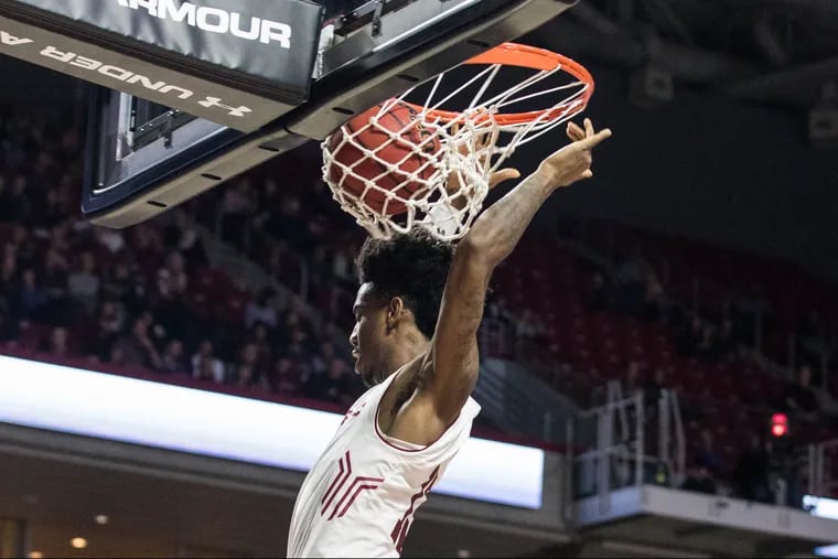 Sophomore guard Quinton Rose dunks the ball during the second half of Temple's 75-56 win over UCF at The Liacouras Center on Sunday, February 25, 2018. SYDNEY SCHAEFER / Staff Photographer
