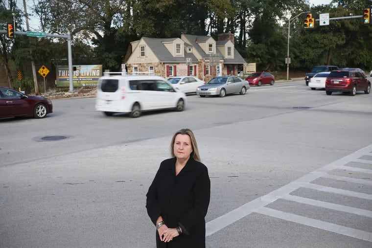 Pattye Benson, president of the Tredyffrin Historic Preservation Trust, stands for a portrait at the intersection of Routes 30 and 252 in Paoli, Pa., on Wednesday, Oct. 17, 2018.