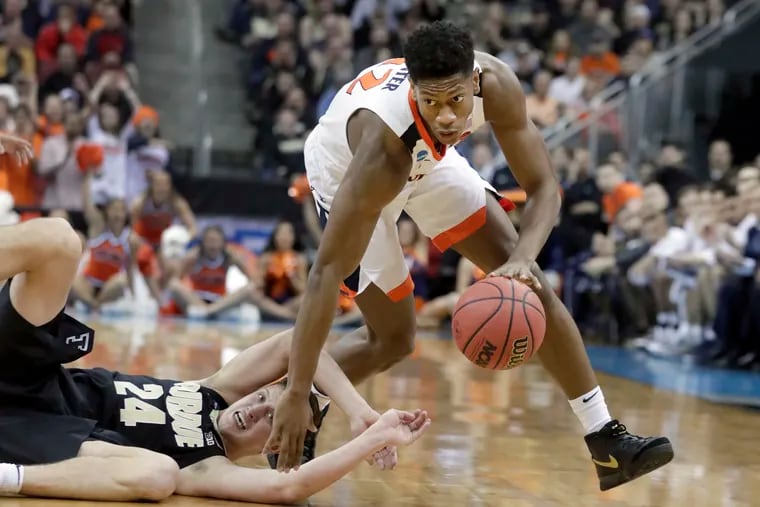 De'Andre Hunter (Friends' Central), right, will likely become the first Virginia player taken in the top 10 of an NBA draft since Olden Polynice was the eighth pick in 1987.