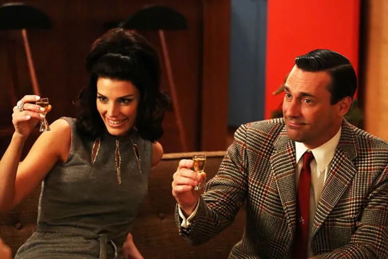 This publicity photo provided by AMC shows Jessica Pare as Megan Draper, left, and Jon Hamm as Don Draper in a scene of "Mad Men," Season 6, Episode 2. (AP Photo/AMC, Michael Yarish)