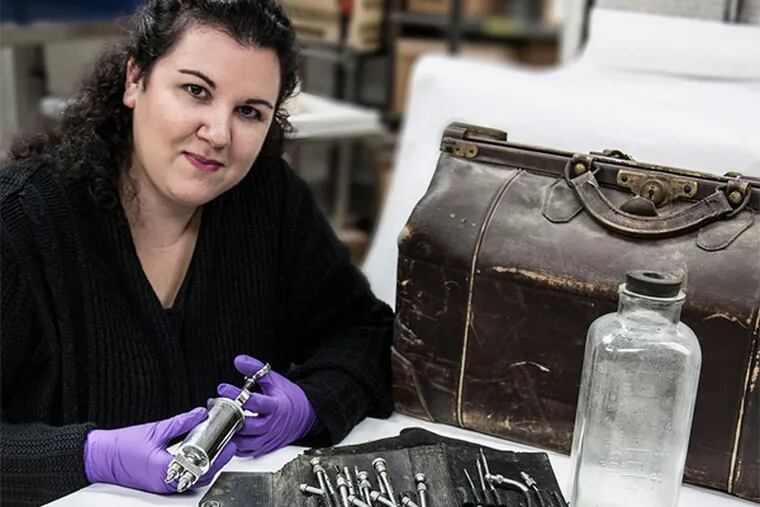 The M&#0252;tter Museum's Anna Dhody with 1950s embalming instruments. &quot;The Civil War was the catalyst,&quot; she says. EVI NUMEN / M&#0252;tter Museum