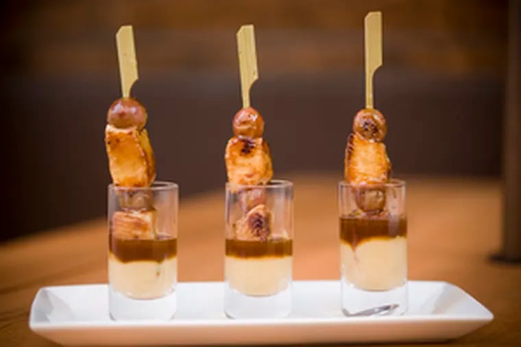 Brochetas of chicken and grapes dunked in truffled garbanzo puree.