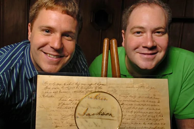 Nathan (left) and Jonas Raab, of the Raab Collection, with the letter by President Andrew Jackson. (Clem Murray / Staff Photographer)