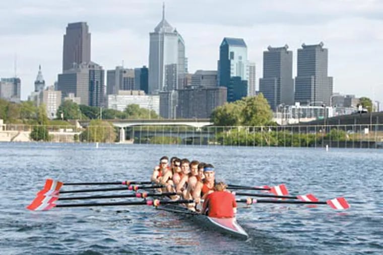 The varsity eight crew from Saint Joseph's University works out on the Schuylkill River in preparation for the Dad Vail Regatta. (Barbara L. Johnston/Inquirer)