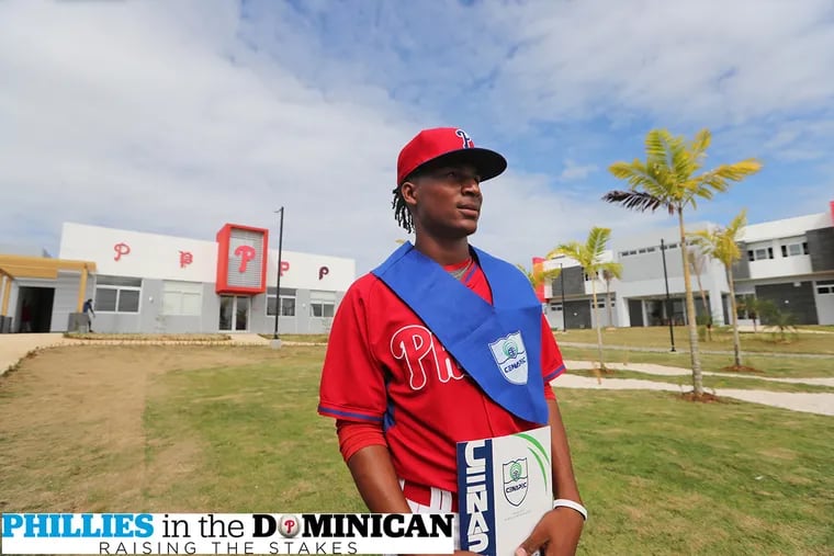 Pitcher Sixto Sánchez, 18, graduates with an eighth-grade education at the Phillies' new academy in Boca Chica, Dominican Republic on Wednesday Jan. 18 , 2017.