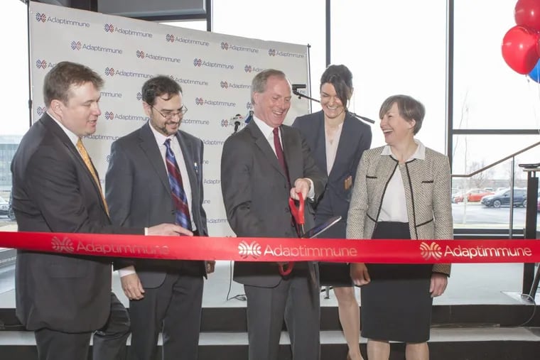 Adaptimmune headquarters ribbon-cutting ceremony at the Navy Yard. Left to right: Adrian Rawcliffe, chief financial officer; Rafael Amado, chief medical officer; James Noble, chief executive officer; Gwen Binder-Scholl, chief technology officer; and Helen Tayton-Martin, chief business officer and company cofounder.