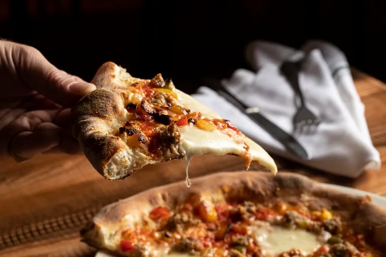 The sausage pizza features Fiorella Sausage, Roasted Peppers, Mozzarella, and Locatelli at Pizzeria Salvy in Philadelphia, Pa. on Tuesday, Aug. 8, 2023.