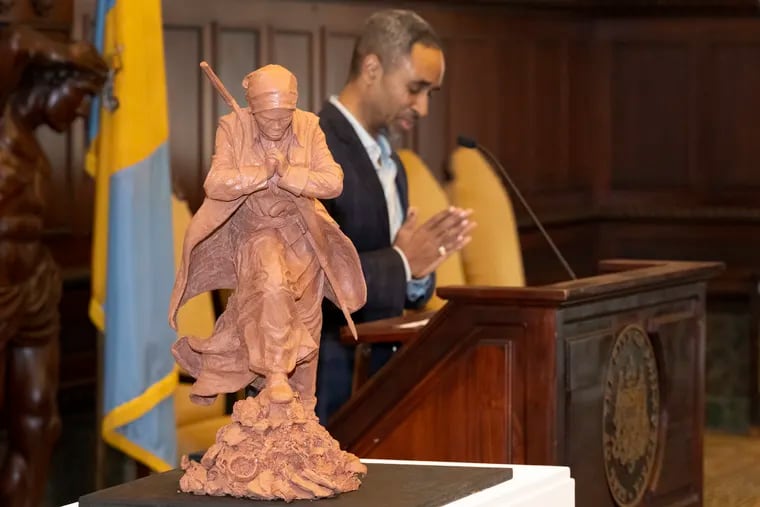Artist Alvin Pettit spoke at the podium as his winning sculpture of Harriet Tubman was unveiled on Monday.