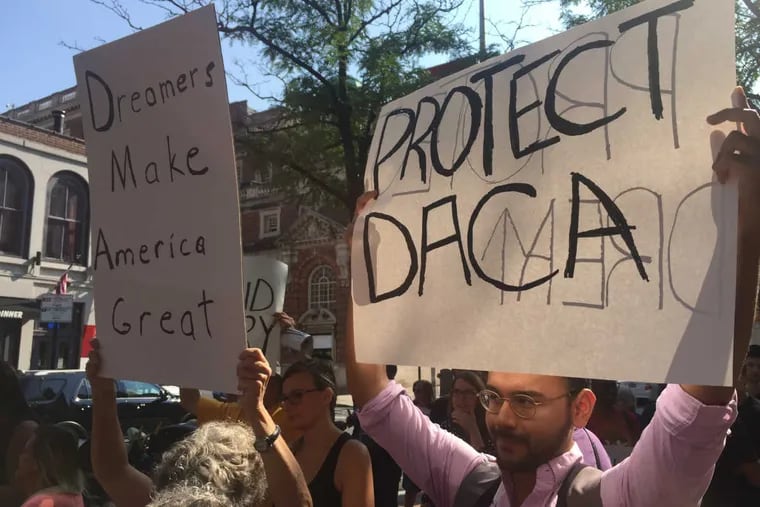 Pro-DACA demonstrators rally outside the local Department of Justice offices at 2nd and Chestnut Streets on Tuesday.