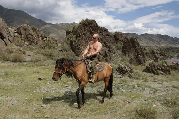 Vladimir Putin is well-known for showing off his masculinity in photo ops. In this August 2009 photo, he rides a horse shirtless. Then the prime minister, Putin is now Russia’s president.