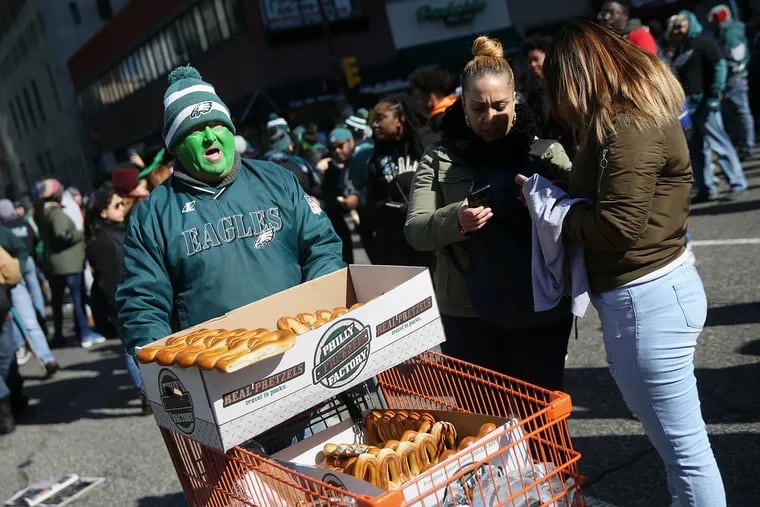 Robert Roberts sells soft pretzels in the crowd before the Eagles' Super Bowl parade in 2018.
