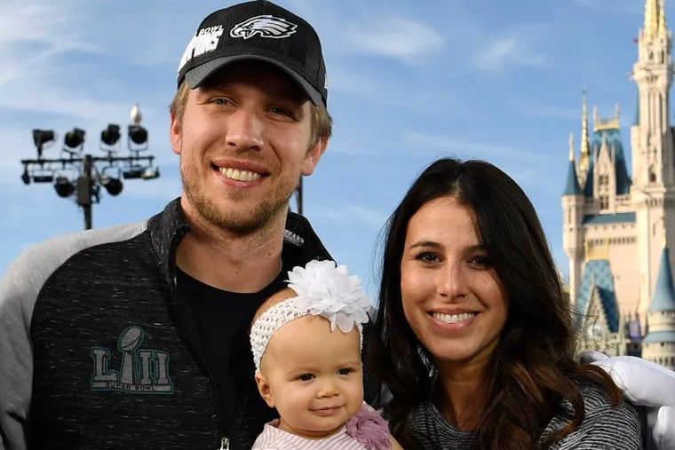 Former Eagles quarterback Nick Foles with his wife, Tori, and daughter, Lily, in February 2018.