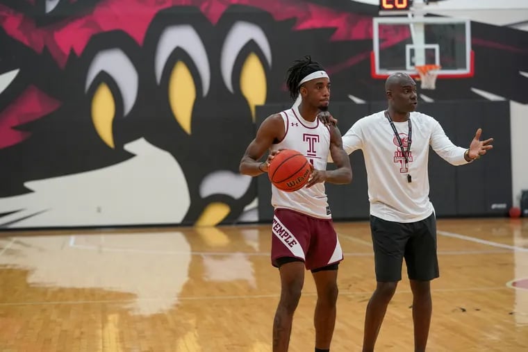 First-year Temple head coach Aaron McKie (right) expects leadership help from senior guard Quinton Rose (left) this season.