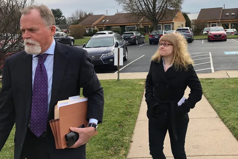 Tina Smith walks into district court in Doylestown with her attorney, Robert Goldman. Smith is accused of possessing weapons of mass destruction for explosive devices recovered from the Quakertown home she shared with her longtime boyfriend, David Surman Jr.