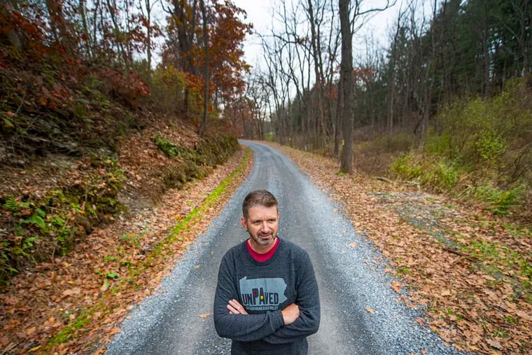 Dave Pryor stands along a dirt road in Lehigh County, Pa. Pryor organizes dirt and gravel roads races in the state of Pennsylvania.