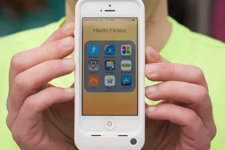 Dan Gray regulary uses nine apps on his smartphone to monitor his health. (Rex C. Curry/Dallas Morning News/TNS)