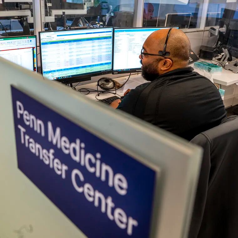 William Martin works in Penn's transfer center at the Hospital of the University of Pennsylvania Wednesday, It’s where PennSTAR medical helicopters are directed, but also where transfers of all kinds to Penn's three Philadelphia hospitals are coordinated.