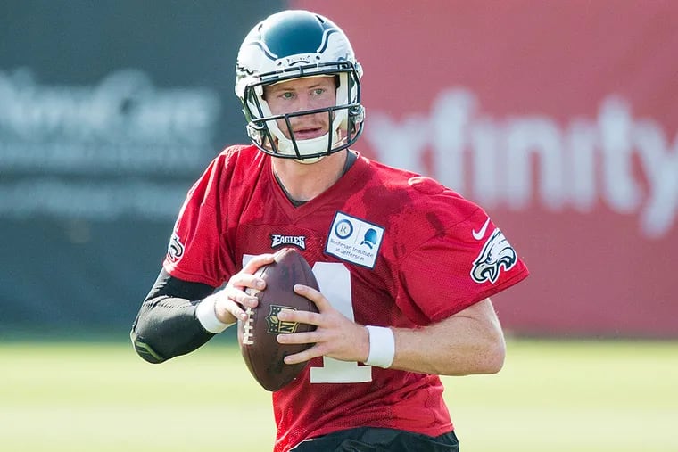 Philadelphia Eagles quarterback Carson Wentz  drops back to pass during practice at NFL football training camp, Monday, July 25, 2016, in Philadelphia.