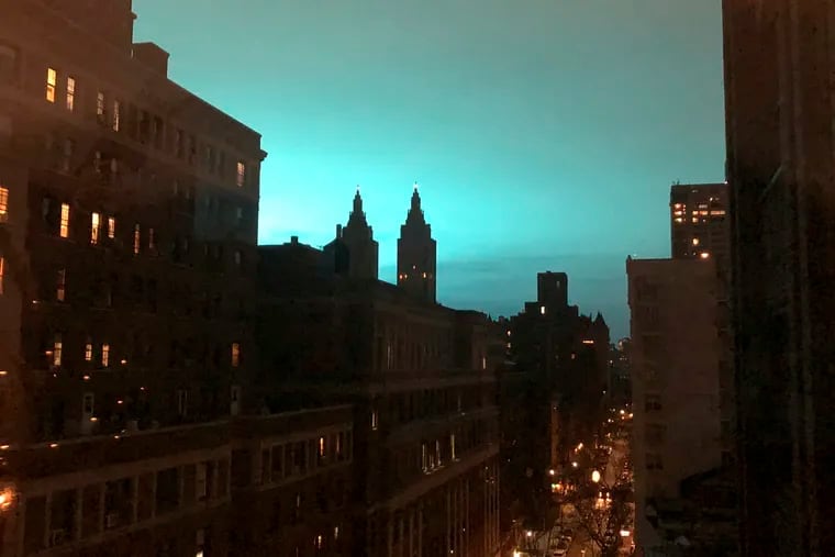 This photo shows blue light over New York, as seen from Manhattan Brough of New York on Thursday, Dec. 27, 2018. New York police said a transformer exploded at a Con Edison facility in Queens on Thursday, causing some power outages. (AP Photo/Jay Reeves)