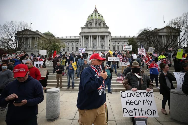 Protesters gather outside the Capital Complex in Harrisburg, PA on April 20, 2020. They are calling for Gov. Wolf to reopen up the state's economy during the coronavirus outbreak.