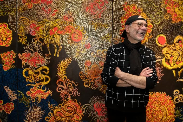 Artist Henry Bermudez in front of his 2007 painting 'The Heavens,' at the opening reception for his exhibit Wilderness in Mind, at Taller Puertorriqueño on Feb. 7, 2020.