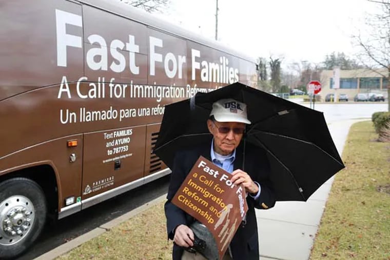 Local activist Hiro Nishikawa walks outside of U.S. Rep. Pat Meehan’s district office in Springfield, Pa., Wednesday April 2, 2014. ( DAVID SWANSON / Staff Photographer )