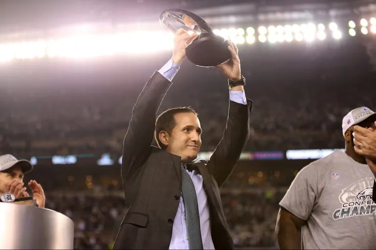 Yeah, we didn’t see this coming. Howie Roseman lifts the NFC Championship trophy after Sunday’s resounding win over the Vikings.
