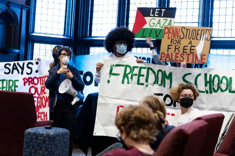 Hilah Kohen, an Israeli American Jewish graduate student at Penn, speaks with a megaphone during a sit-in to protest university inaction in relation to the bombings in Palestine, at Houston Hall at the University of Pennsylvania.