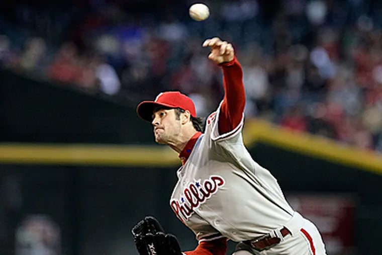 Cole Hamels throws against the Arizona Diamondbacks in the first inning of a 7-4 loss. (AP Photo/Rick Scuteri)