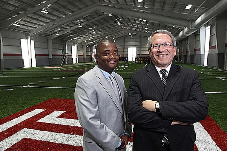 Temple athletic director Kevin Clark, left, and Temple President Neil Theobald. (Michael Bryant/Staff Photographer)