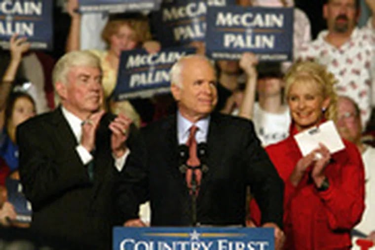 Sen. John McCain, flanked by his wife, Cindy, and former New York Rep. Jack Kemp, addresses a rally in Dayton, Ohio. Later, he visited Pottsville, Pa.