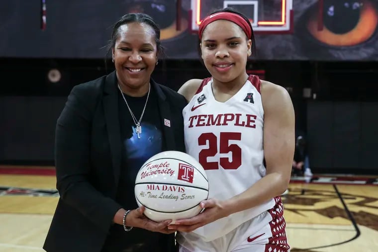 Temple head coach Tonya Cardoza with Mia Davis, who is holding her all-time leading scorer basketball after a game against Wichita State in Philadelphia on Wednesday. Temple beat Wichita State, 70-49.