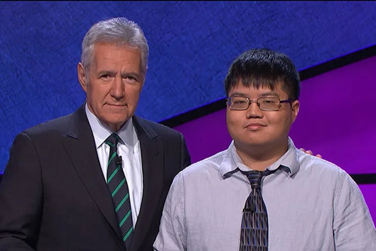 Swarthmore grad and Jeopardy! champ Arthur Chu, pictured with show host Alex Trebek. (courtesy Jeopardy Productions, Inc.)
