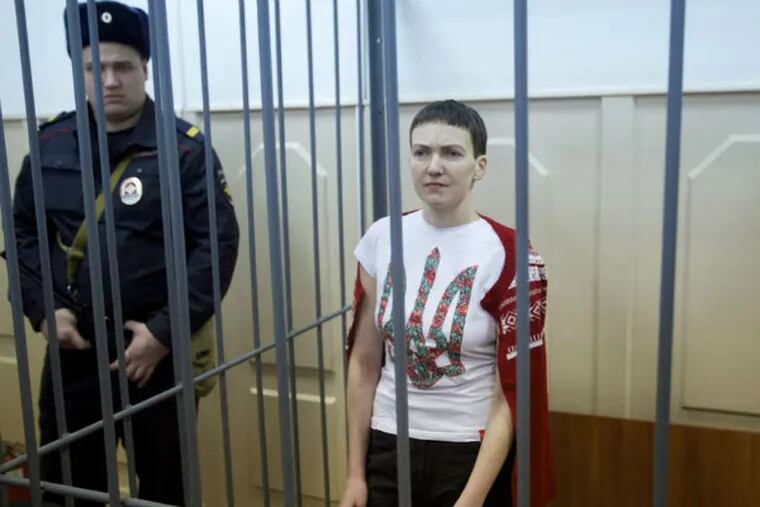 Unkrainian pilot Nadiya Savchenko stands in a cage in a courtroom in Moscow on Feb. 10. She has been on a hunger strike for more than 70 days.