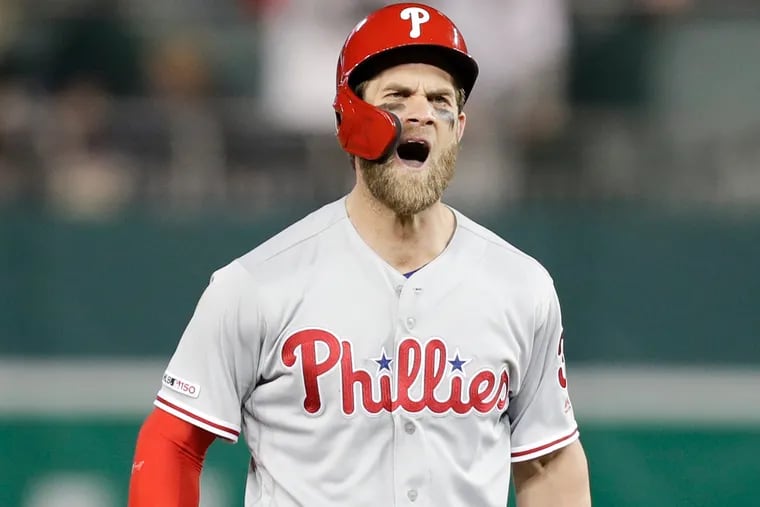 Phillies Bryce Harper yells after hitting a RBI single and advancing to second on the throw against the Washington Nationals on Tuesday, April 2, 2019 in Washington D.C.