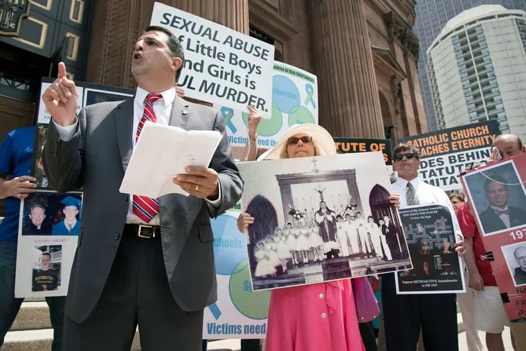 Pennsylvania Rep. Mark Rozzi, a clergy abuse victim, leads a group of advocates and fellow victims in a protest outside the Cathedral Basilica of SS. Peter and Paul.