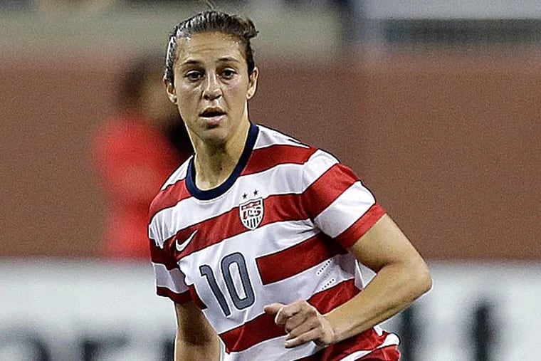 Carli Lloyd had been out of commission with a broken bone in her left shoulder since March 6. (Paul Sancya/AP file photo)