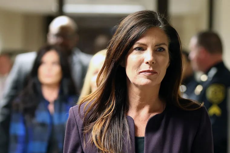 Attorney General Kathleen Kane leaves the courtroom at the Montgomery County Courthouse in Norristown on Nov. 10, 2015.