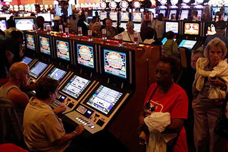 FILE photo: People gamble at the newly opened SugarHouse Casino in Philadelphia, Thursday, Sept. 23, 2010. The City of Brotherly Love became the largest U.S. city with a casino when SugarHouse opened. (AP Photo/Matt Rourke)