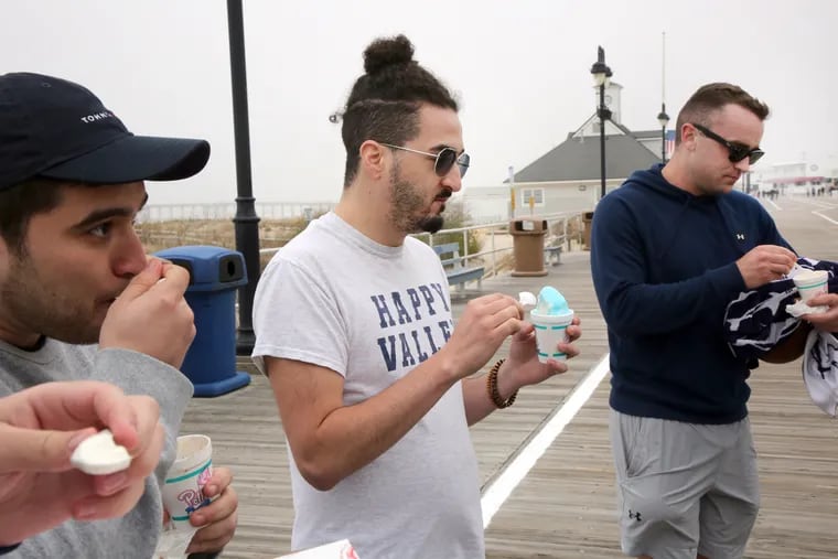 Jarrett Gibbs, of Long Island, N.Y., munches on a gelato he purchased at the Polish Water Ice store on the boardwalk in Ocean City, N.J., Thursday, May 12, 2022.  Gibbs said he paid $6.50 for the small-size portion.
