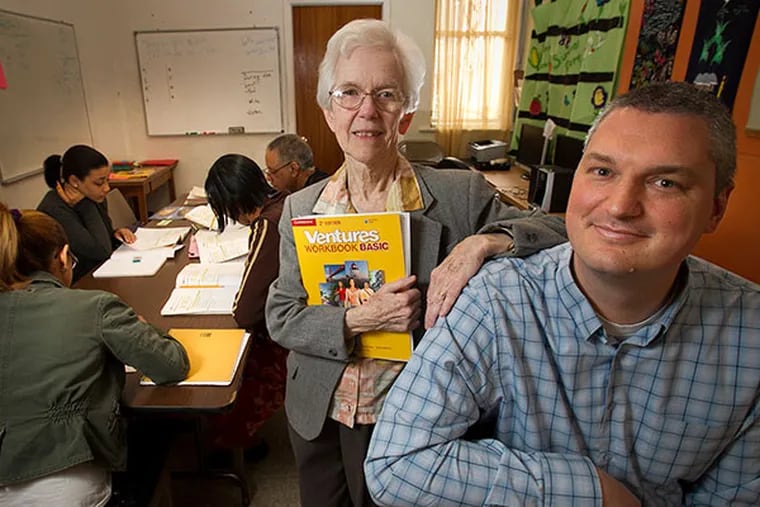 Sister Margaret "Peggy" Doherty, the last of the original founders of the Providence Center in the West Kensington section of Philadelphia, with Executive Director David Chiles during an English language class on Friday, April 11, 2014. ( ALEJANDRO A. ALVAREZ / STAFF PHOTOGRAPHER )
