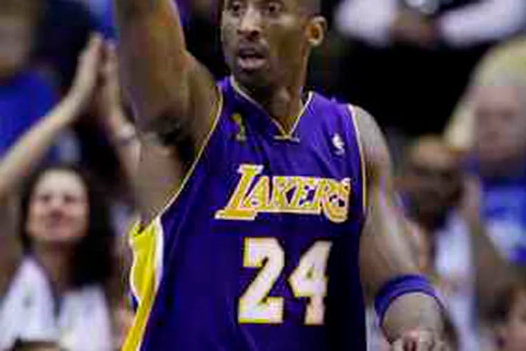 Kobe Bryant scored 30 points on the way to his fourth NBA title as the Lakers beat the Magic.